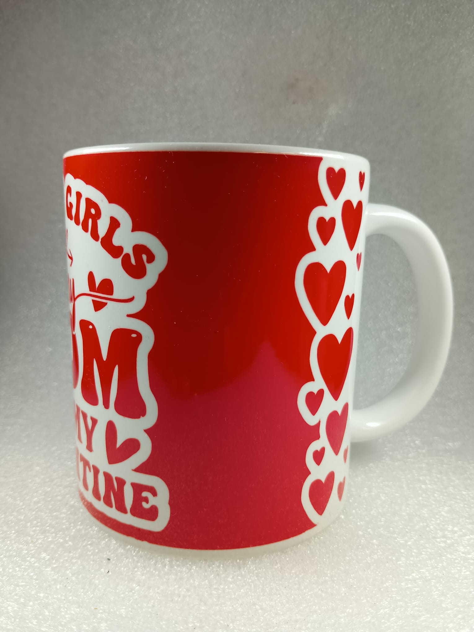 white mug with red print